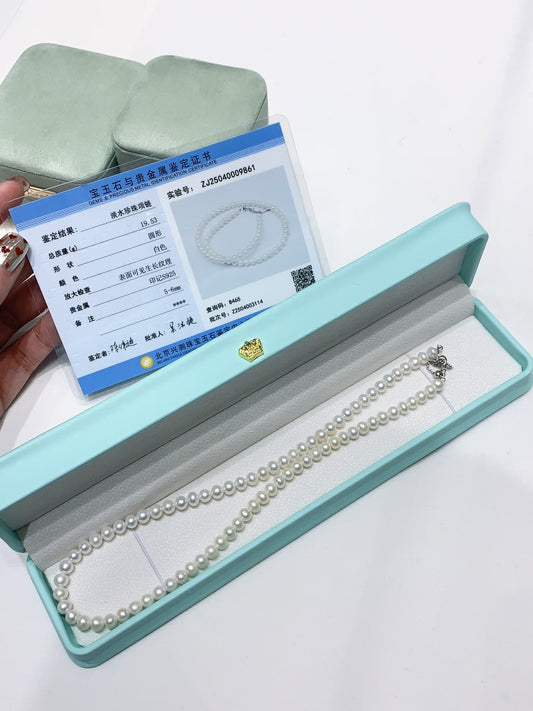 Fine 5-6mm round white freshwater pearl necklace